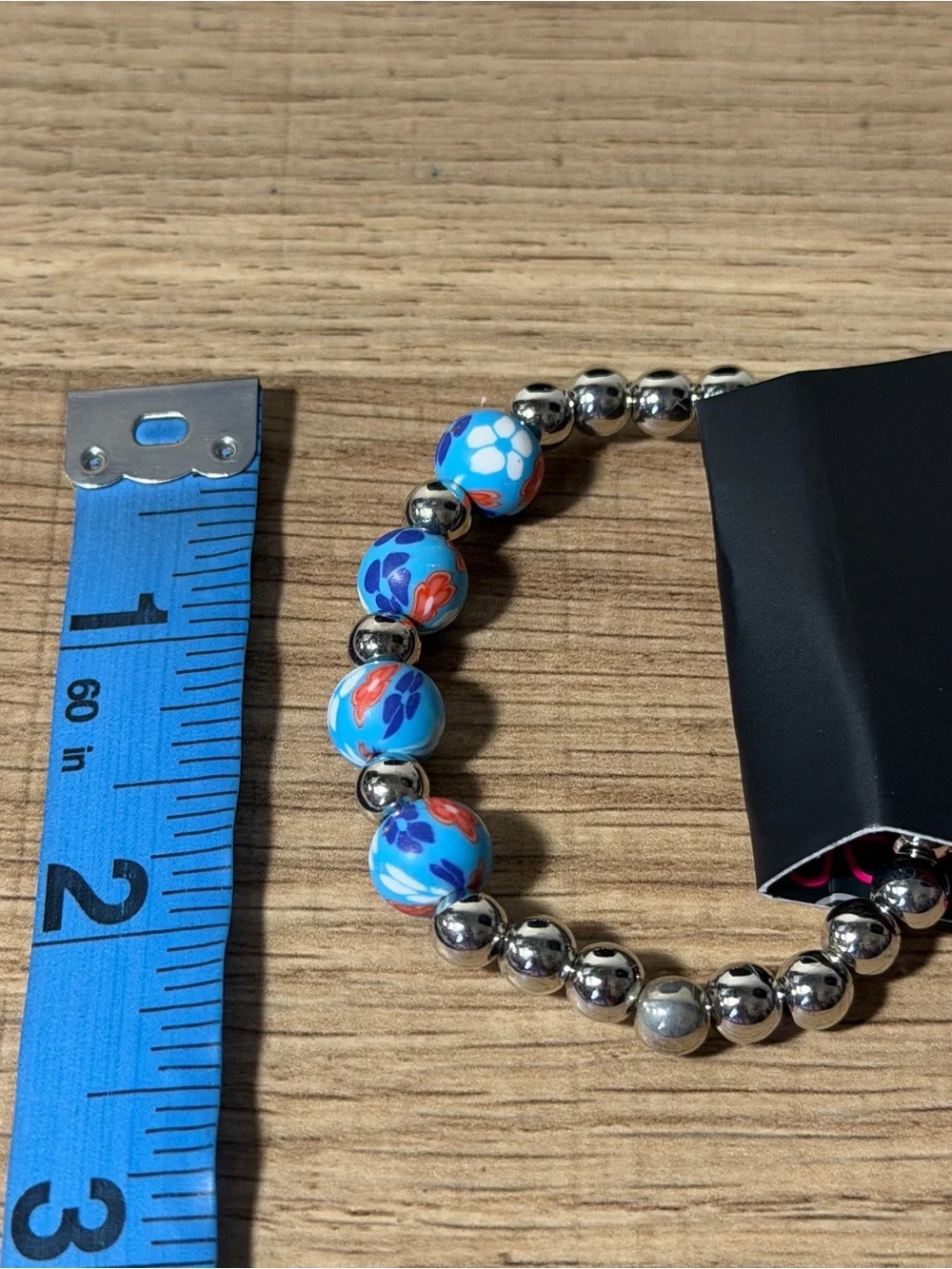 paparazzi Blue Floral Stretch Bracelet with Silver Beads and Red Accents